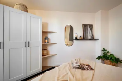 a kitchen with a washer and dryer at Aino - 2 bedrooms and balcony in Eixample Esquerra in Barcelona