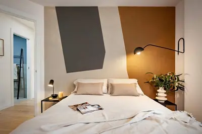 a bedroom with a large bed and a mirror at Aino - 2 bedrooms and balcony in Eixample Esquerra in Barcelona