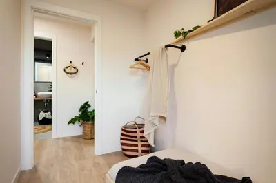 a living room with a couch and a table with a lamp at Aino - 2 bedrooms and balcony in Eixample Esquerra in Barcelona