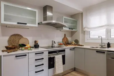 a bedroom with a large white bed with a window at Nava - 3 bedrooms in Sant Gervasi in Barcelona