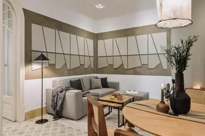 a living room with a couch and a table at Uru - 2 bedrooms and balcony in Vila de Gràcia in Barcelona