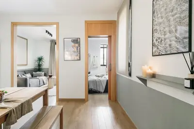 a bedroom with a large bed with a tray on it at Furore - 1 bedroom in Eixample Esquerra in Barcelona