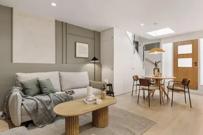 a living room with a couch and a table at Monterrico - 2 bedrooms and terrace in Gràcia in Barcelona