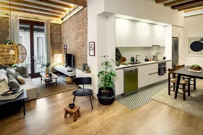 a living room with a couch and a table at Kasa - 2 bedrooms in Ciutat Vella in Barcelona