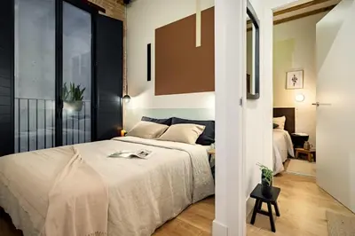 a kitchen with a black table and chairs at Kasa - 2 bedrooms in Ciutat Vella in Barcelona