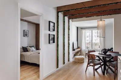 a bedroom with a bed and a desk and a desk at Lescun - 2 bedrooms in Eixample Esquerra in Barcelona