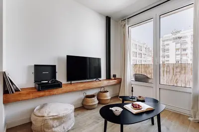 a bedroom with a bed with a book on it at Lescun - 2 bedrooms in Eixample Esquerra in Barcelona