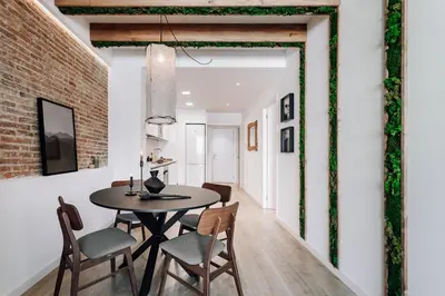 a living room with a couch and a table at Lescun - 2 bedrooms in Eixample Esquerra in Barcelona