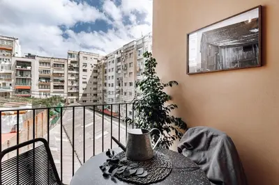 a kitchen with a table and chairs in a room at Biescas - 1 bedroom in Eixample Esquerra in Barcelona
