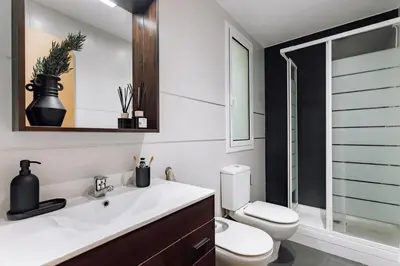 a living room with a couch and a table at Biescas - 1 bedroom in Eixample Esquerra in Barcelona