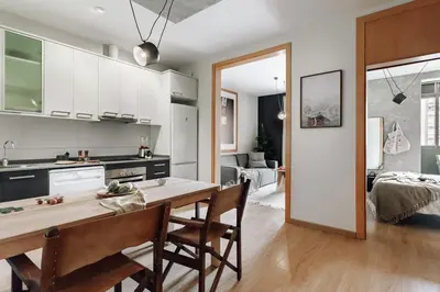 a living room with a couch and a table at Biescas - 1 bedroom in Eixample Esquerra in Barcelona