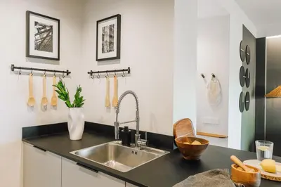 a bedroom with a large bed and two lamps at Haring - 2 bedrooms in Gràcia in Barcelona