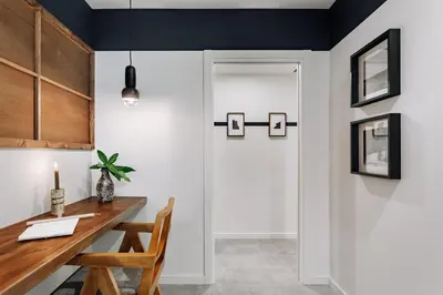 a dining room with a table and a door at Mont - 2 bedrooms and office in Eixample Esquerra in Barcelona