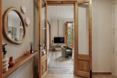 a bedroom with a bed with a tray on it at Kaax - 3 bedrooms and balcony in Eixample in Barcelona