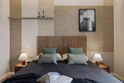 a small bedroom with a bed and a shelf at Atitlan - 3 bedrooms, office and balcony in Eixample Esquerra in Barcelona