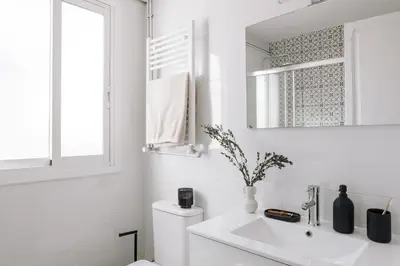 a living room with a couch and a tv at Lugros - 3 bedrooms in Gràcia in Barcelona