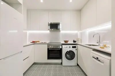 a living room with a table and a bedroom at Batipaglia - 2 bedrooms and terrace in Ciutat Vella in Barcelona
