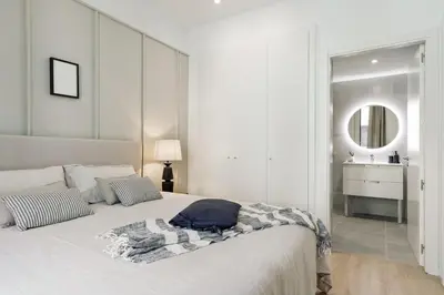 a bedroom with a large white bed with a window at Batipaglia - 2 bedrooms and terrace in Ciutat Vella in Barcelona