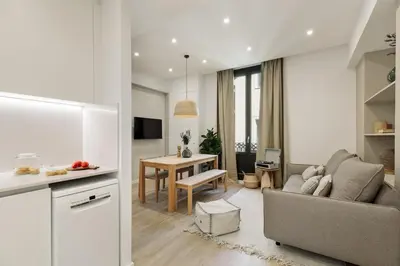 a living room with a couch and a table at Batipaglia - 2 bedrooms and terrace in Ciutat Vella in Barcelona
