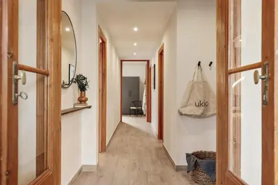 a living room with a couch and a table at Potosi - 3 bedrooms and balcony in Eixample Dreta in Barcelona
