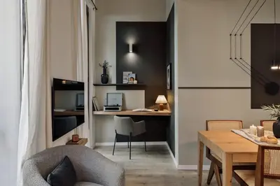 a living room with a desk and a chair at Chuck - 2 bedrooms and balcony in Sant Antoni in Barcelona