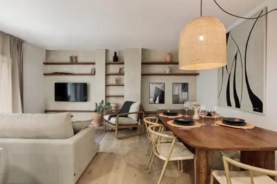 a bedroom with a large bed and a mirror at Begur - 3 bedrooms and terrace in Sant Gervasi in Barcelona