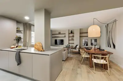 a dining room with a wooden table and chairs at Begur - 3 bedrooms and terrace in Sant Gervasi in Barcelona