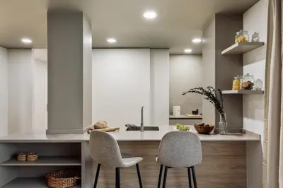 a living room with a table and a couch at Begur - 3 bedrooms and terrace in Sant Gervasi in Barcelona