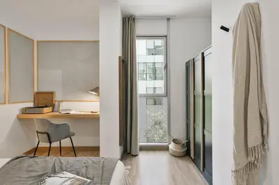 a living room with a couch and a plant at Sabia - 2 bedrooms in Poblenou in Barcelona