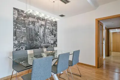 a dining room with a glass table and chairs at Modern Penthouse with Large Terrace in Poblenou Perfect for Holidays or Work Close to the Beach and Public Transport in Barcelona
