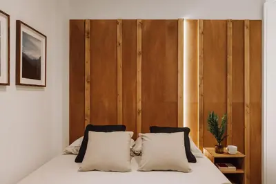 a bedroom with a mirror and a bed and a window at Dabo - 3 bedrooms in Eixample Esquerra in Barcelona