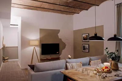a bedroom with a bed and a mirror at Ejido - 1 bedroom and terrace in Gràcia in Barcelona