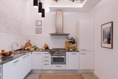 a room with a hallway with a brick wall at Ejido - 1 bedroom and terrace in Gràcia in Barcelona