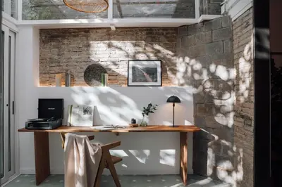 a white kitchen with white cabinets and a sink at Ejido - 1 bedroom and terrace in Gràcia in Barcelona