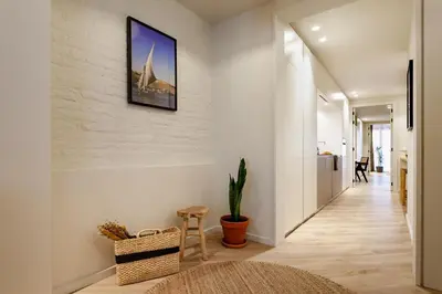 a living room with a couch and two tables at Baharya - 2 bedrooms in Eixample Dreta in Barcelona