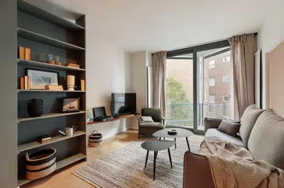 a living room with a couch and a table at Garraf - 2 bedrooms and balcony in Sant Gervasi in Barcelona