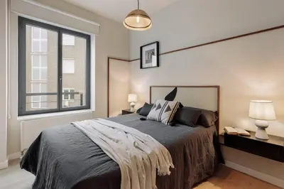 a living room with a couch and a flat screen tv at Garraf - 2 bedrooms and balcony in Sant Gervasi in Barcelona