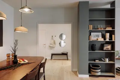 a dining room and living room with a table and chairs at Garraf - 2 bedrooms and balcony in Sant Gervasi in Barcelona