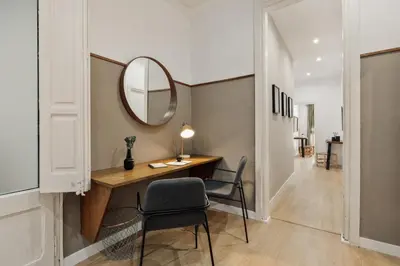 a bedroom with a bed with a brick wall at Malang - 2 bedrooms with terrace in Gràcia in Barcelona
