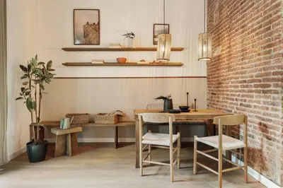 a hallway with a mirror and a wooden table at Malang - 2 bedrooms with terrace in Gràcia in Barcelona