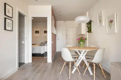 a bathroom with a sink and a table at Acogedor Apartamento Centro , Cerca de Plaza España y Barcelona in Hospitalet de Llobregat
