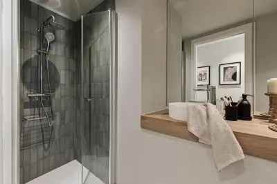 a bedroom with a bed with a clock on the wall at Kevran - 2 bedrooms and terrace in Sant Pere in Barcelona