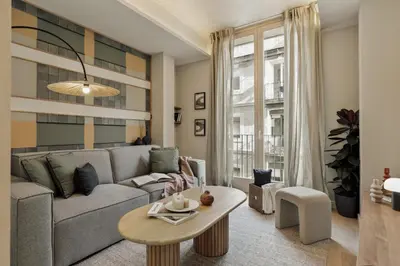 a living room with a couch and a table at Kevran - 2 bedrooms and terrace in Sant Pere in Barcelona