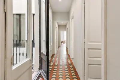 a living room with a couch and a tv at Albori - 2 bedrooms and balcony in Eixample Dreta in Barcelona