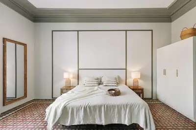 a living room with a couch and a large window at Albori - 2 bedrooms and balcony in Eixample Dreta in Barcelona