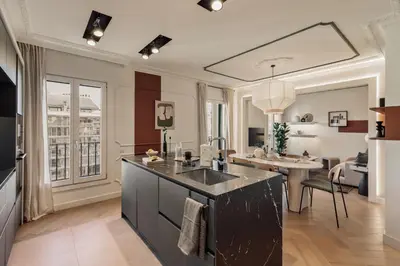 a kitchen with a sink and a living room at Fener - 3 bedrooms in La Dreta de l'Eixample in Barcelona