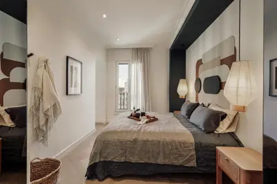 a living room and dining room with a dining table at Fener - 3 bedrooms in La Dreta de l'Eixample in Barcelona