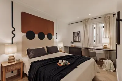 a living room with a couch and a table at Fener - 3 bedrooms in La Dreta de l'Eixample in Barcelona