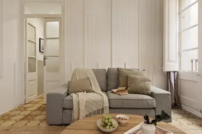 a living room with a couch and a table at Pano - 2 bedrooms in St Pere Sta Caterina i Ribera in Barcelona