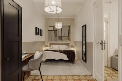 a bedroom with a bed and a couch at Pano - 2 bedrooms in St Pere Sta Caterina i Ribera in Barcelona